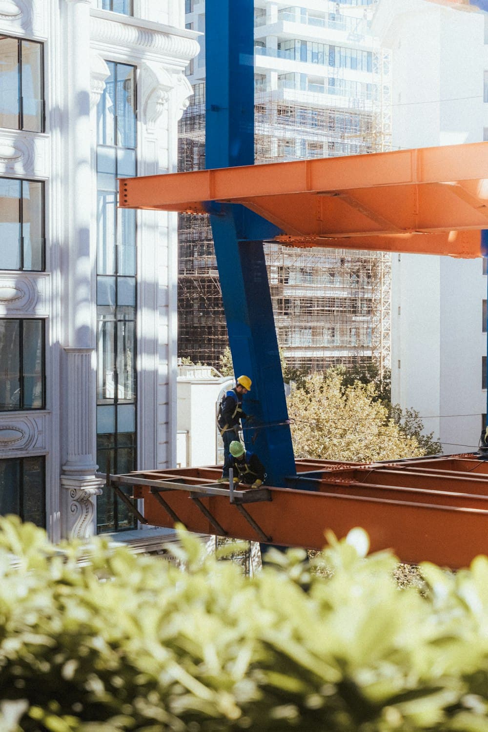 Construction site with structural steel and cranes