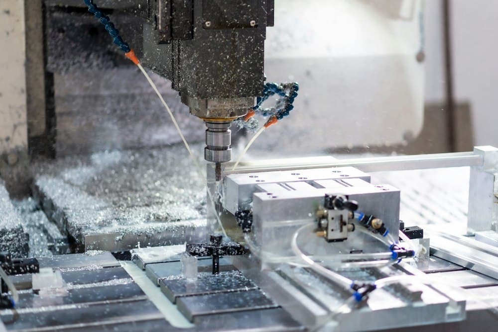 CNC machining centre cutting a metal component